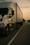 Commercial tractor-trailer on a highway at dusk