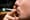 Close-up of a lcigarette in a man's mouth