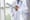 Two doctors in white lab coats reviewing a patient chart.