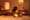 A dimly lit spa room with candles and massage table showng a relaxing atmosphere.