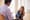 A therapist has a discussion with a teenaged girl in his office