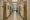 Empty institutional hallway with closed doors.