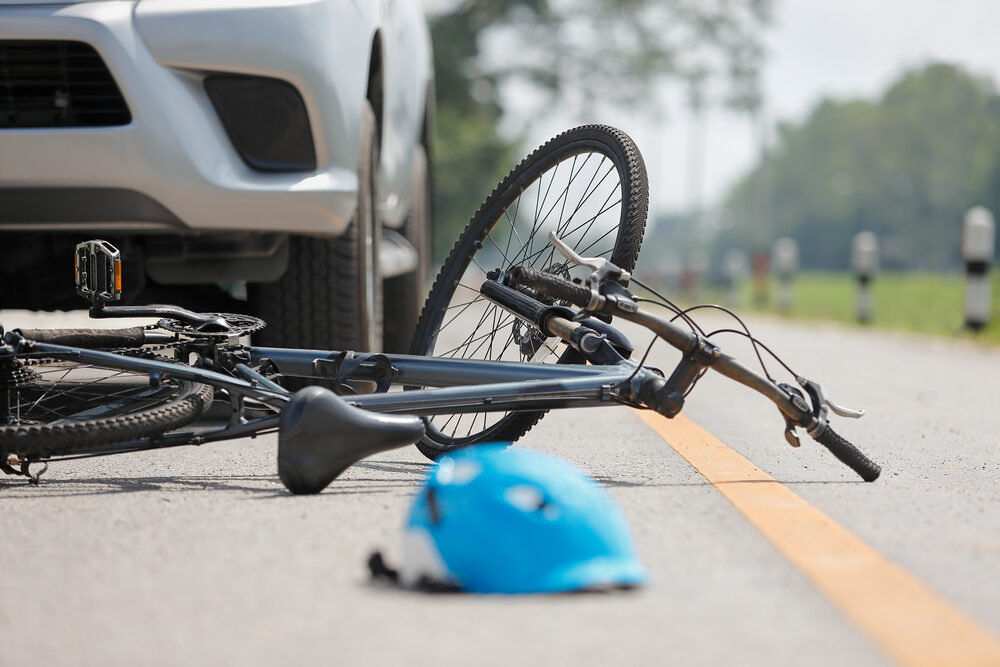 bicycle and helmet on the road after an accident