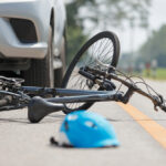 bicycle and helmet on the road after an accident