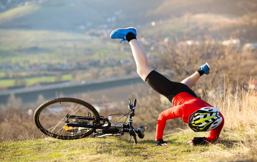Understanding the Dangers of Defective Bike Products Mountain Biker has a painful looking crash with his bike