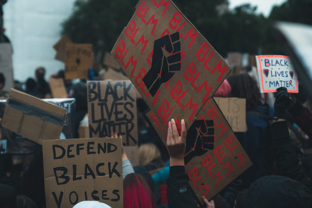 Black lives matter protest with signs and crowd