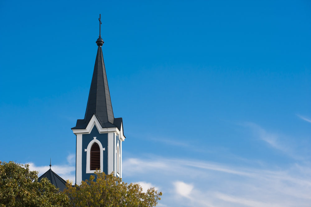 Steeple of the blue church with blue sky