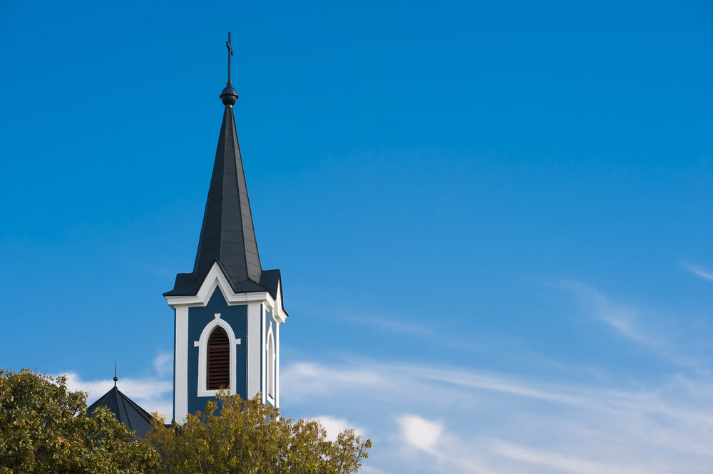 Ruben A. Garcia Listed in SBC Abuse Report Steeple of the blue church with blue sky