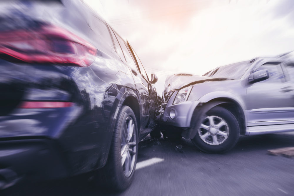 SUV car crashing beside another one on the road with speed zoom blur.