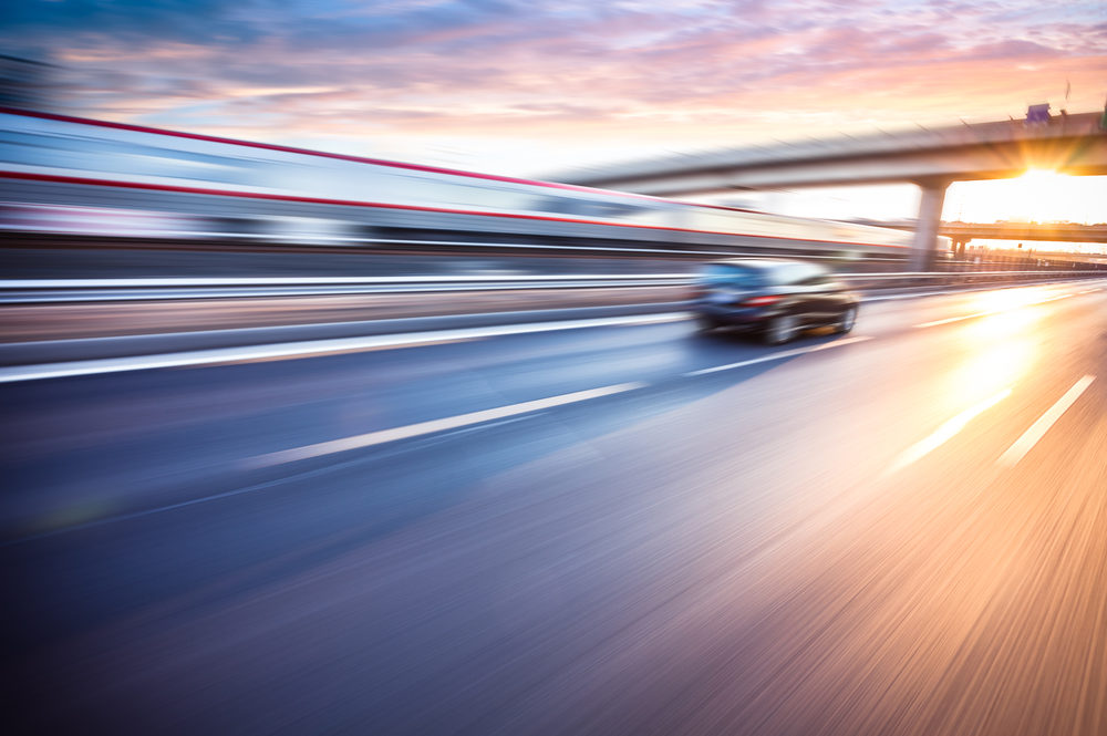 How Speeding Contributes to Deadly Virginia Car Crashes Car driving on freeway at sunset, motion blur