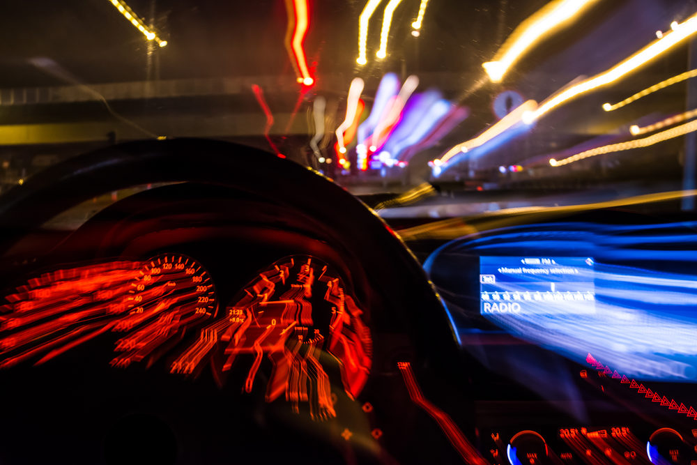 blurred view from inside of a car at night