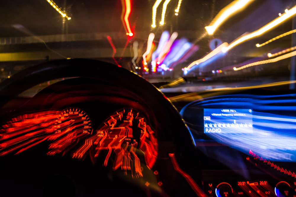 What Kinds of Damages Can You Seek After a DUI Accident? blurred view from inside of a car at night