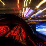 blurred view from inside of a car at night
