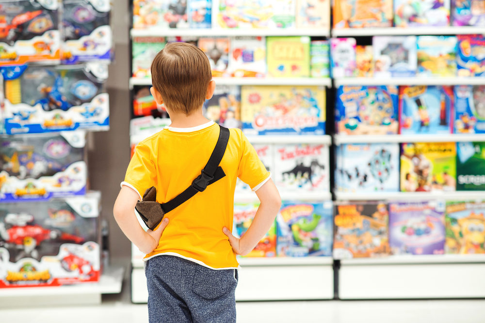 child shopping for toys in a store