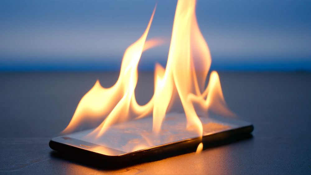 Smartphone is burning on a table