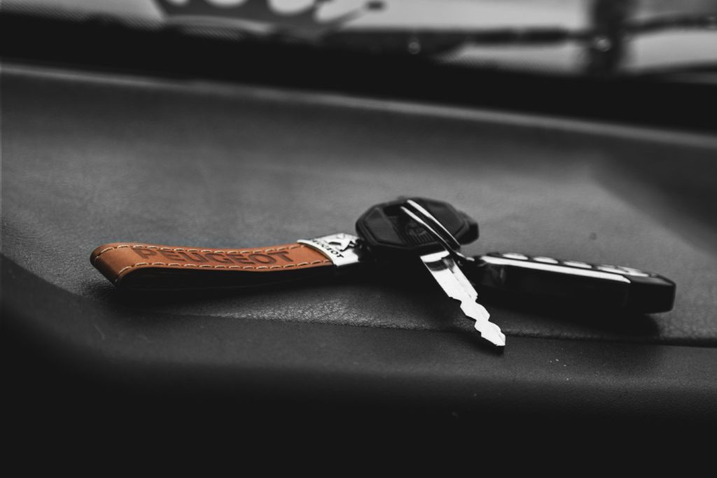 A key fob sits ona car dashboard