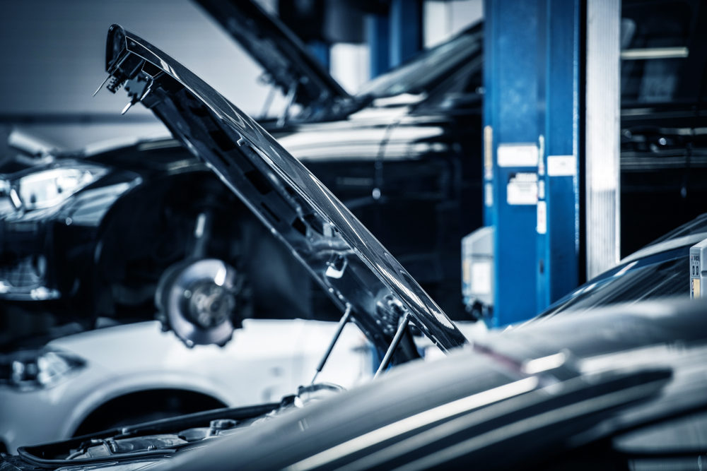 cars ready for repair in an automotive garage