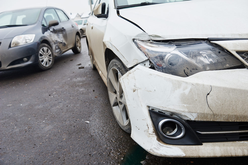 damaged automobiles after collision in city