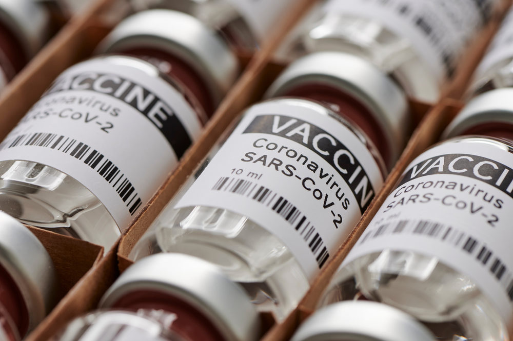 Update on COVID-19 Vaccine Injury Claims Some ampoules with ncov-2019 vaccine in a box.