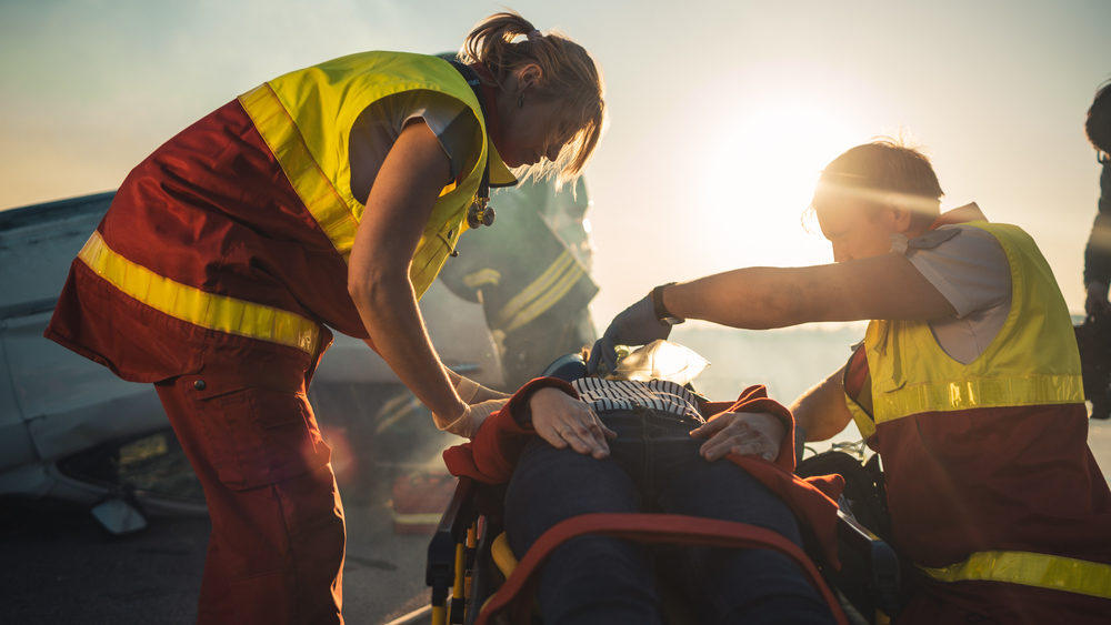 Paramedics Saving Life of a Female Victim who is Lying on Stretcher