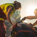 Paramedics Saving Life of a Female Victim who is Lying on Stretcher