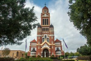 The historic Dutch Romanesque Revival style Cathedral of Saint John the Evangelist or La Cathedrale St-Jean built in 1916 on Cathedral Street in downtown Lafayette, Louisiana