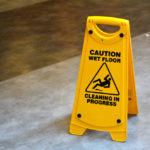 Slippery floor surface warning sign and symbol in building