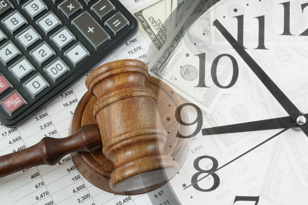 Business concept with calculator, judge gavel, clock, money and documents