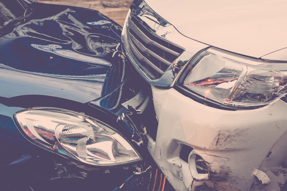 closeup of car crash on roadway