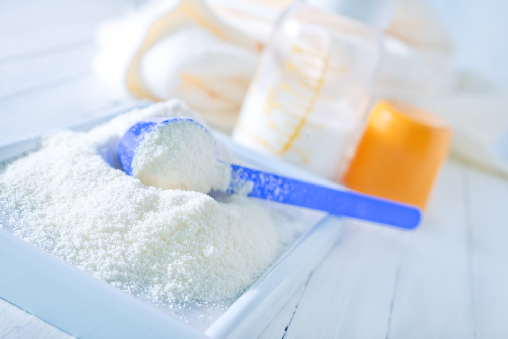 close up of powdered formula and spoon for baby