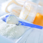 close up of powdered formula and spoon for baby