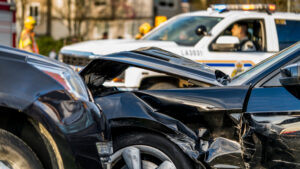  Aftermath of a car crash accident at a very busy intersection.