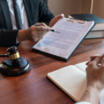 Male Notary lawyer or judge consult or discussing contract papers with Businessman client in office