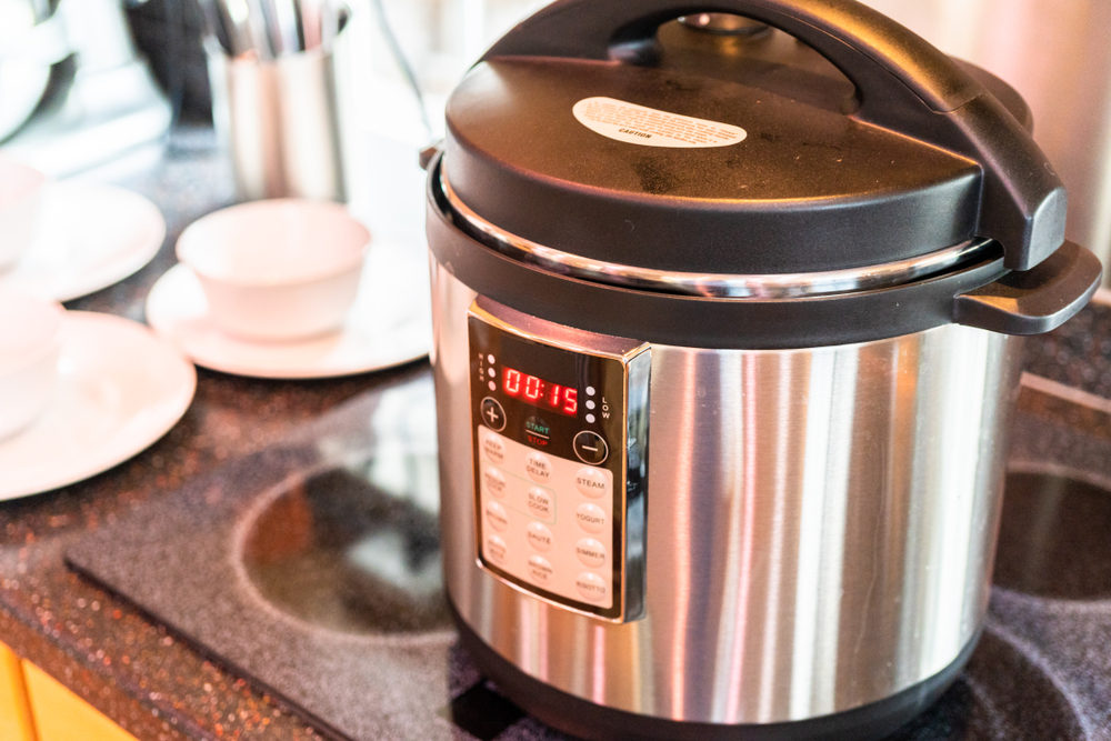 Cooking dinner in a pressure cooker in a modern kitchen.