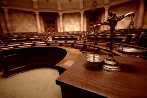 Symbol of law and justice in the empty courtroom