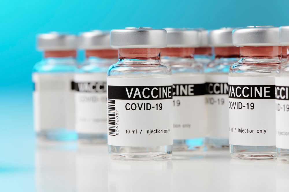 ampoules with Covid-19 vaccine on a laboratory bench.