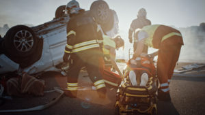 emergency response team at the site of a car crash