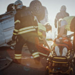 emergency response team at the site of a car crash