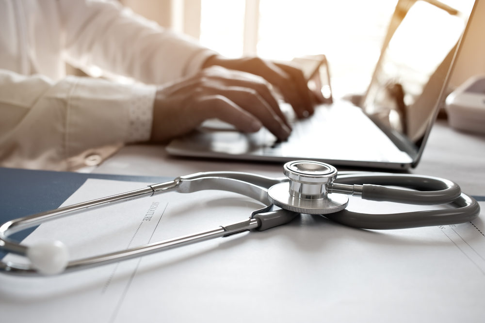 UCLA Agrees to $73 Million Settlement with Victims of Sexual Abuse Doctor working on laptop computer