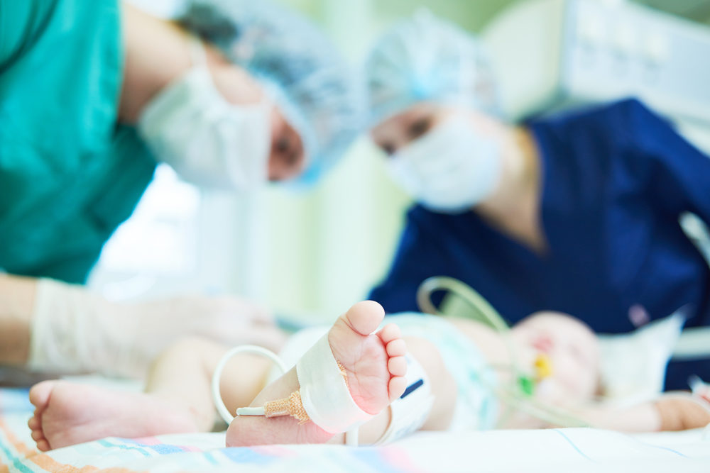 New Research Aims to Reduce Brachial Plexus Birth Injuries Doctor's team doing neonatal resuscitation therapy on newborn baby.