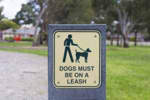 Signs dog must be on leash.