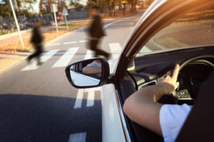 driver lets the pedestrians on the aisle