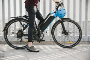 Urban cyclist taking a brake on e-bike