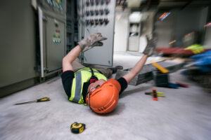electrician on the ground after an injury at a control room