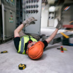 electrician on the ground after an injury at a control room
