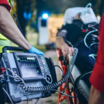 Team of emergency medical service rescuing patient.