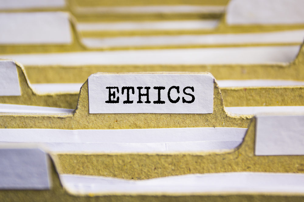 Settlement Compliance Strategies for Closing Cases – Ethical Issues at Settlement Ethics word on card index paper