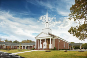 White and Brown Baptist Church Exterior with White Steeple towe