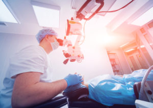  A patient and surgeon in the operating room during ophthalmic surgery.