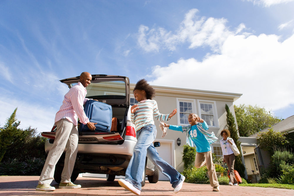 children running to welcome father home from road trip.